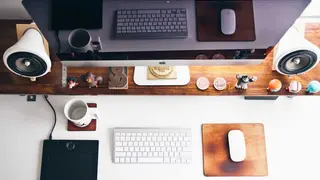 Desk with a keyboard and monitor